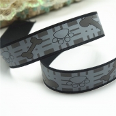 Printed grosgrain reflective ribbon black paw prints